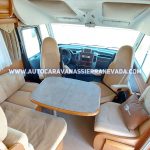 Autocaravana integral RAPIDO, modelo 990M, con un diseño muy selecto y cotizado en su interior gracias a su cama isla de 1,40 para dos personas.